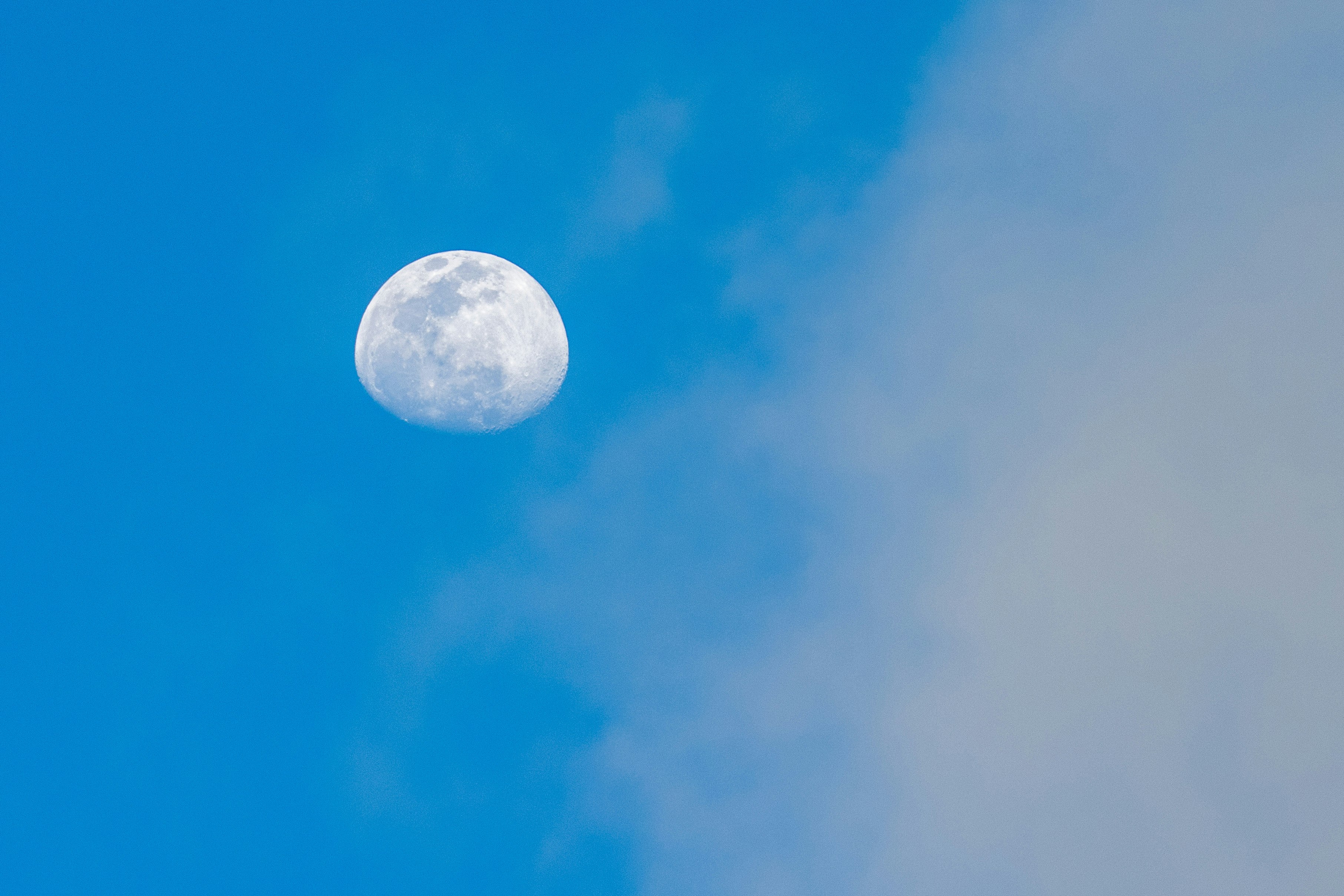 full moon in blue sky